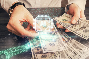 Double exposure of technology drawing hologram and us dollars bills and man hands. Data concept