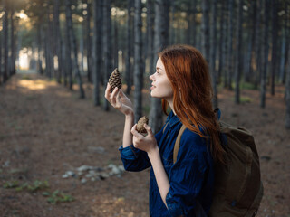 Happy woman tourist with backpack vacation nature fresh air and forest