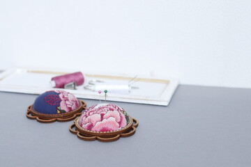 Pincushions in vintage style lying on the table