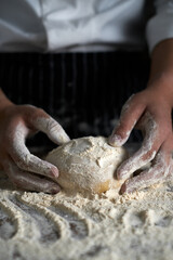 Pastry bakery chef in the kitchen preparing Bread dough. bakery and food concept.