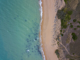 Sicily beach from top down. Blue water top down shot of empty beach in Italy.