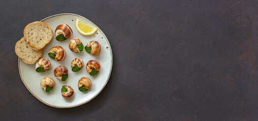 Escargots de Bourgogne. Snails with herbs butter. Healty eating. French food.