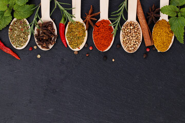 Various spices on dark background. Top view with copy space