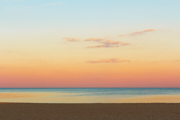 Fototapeta na wymiar Calmness seaside . Calm sea water surface view from the beach . Dawn over the sea