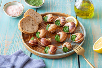 Escargots de Bourgogne. Snails with herbs butter. Healty eating. French food.