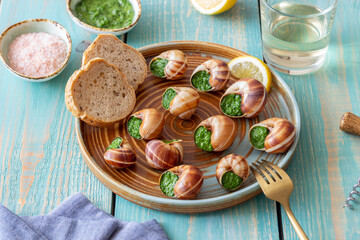 Escargots de Bourgogne. Snails with herbs butter. Healty eating. French food.