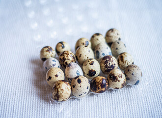 Fototapeta premium quail eggs in plastic packaging for sale, preparing for Easter, quail eggs for a delicious Easter holiday