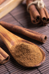 cinnamon on a wooden spoon on the table close-up