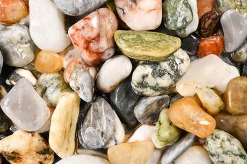 Wet stone pebbles background and rock pebbles texture. High resolution macro close up for your design