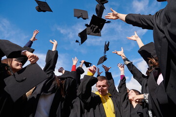 Group of diverse international graduating students celebrating