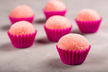 Strawberry brigadeiro covered in sugar, traditional Brazilian sweet.