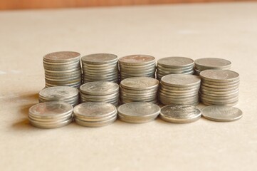 close up coins on wooden table
