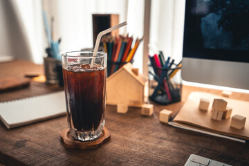 Iced coffee in a mug on the desk