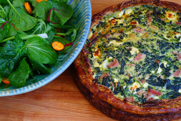 A potato crust quiche with spinach, bacon and goat cheese