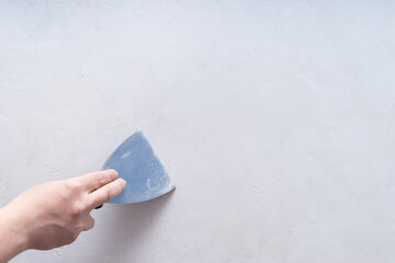 Male painter with a spatula in his hands