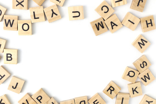 Top view the distribution of letters on wooden tiles scraped in a square shape Isolated on white background. with copy space - Powered by Adobe
