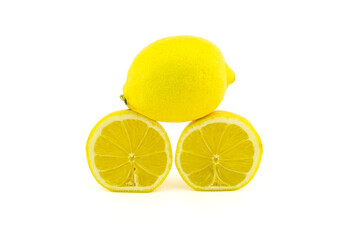 Whole and halved ripe lemon fruit on white