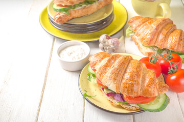 Croissant sandwich with fresh vegetables