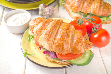 Croissant sandwich with fresh vegetables