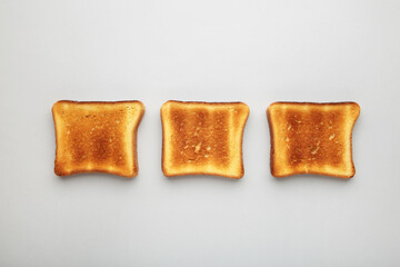 Toast bread on a grey background. Top view, flat lay