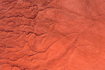 Fototapeta premium Neszmély, Hungary - Aerial view of drought red mud surface, industry waste, abstract nature texture.