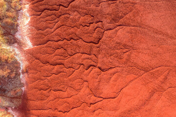 Neszmély, Hungary - Aerial view of drought red mud surface, industry waste, abstract nature texture.