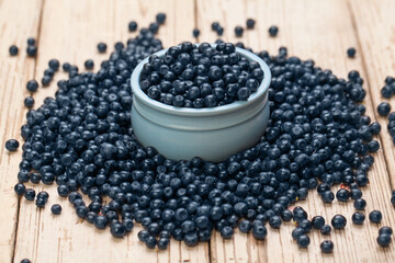 Fototapeta na wymiar Blueberries on blueberries on white vintage background