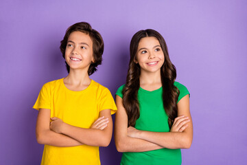 Photo of young kids happy positive smile confident folded hands dream look empty space isolated over violet color background