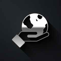 Silver Human hand holding Earth globe icon isolated on black background. Save earth concept. Long shadow style. Vector