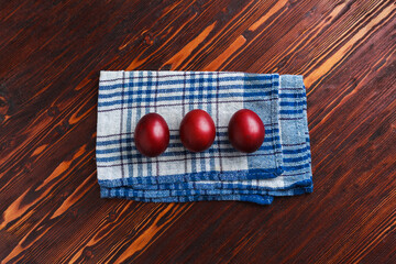Easter eggs colored with natural dye onion skin. How to paint eggs with old non-toxic, eco, zero waste dyeing method. Wooden background. Process step by step