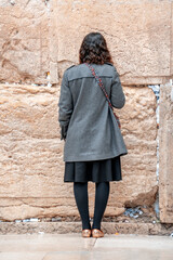 Young jewish girl prays at the Wailing Wall. Jerusalem, Israel (581)