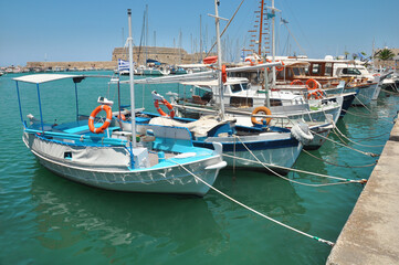 Fototapeta premium Boats docked in the Greek port of Heraklion.