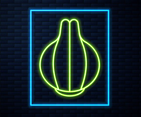 Glowing neon line Onion icon isolated on brick wall background. Vector