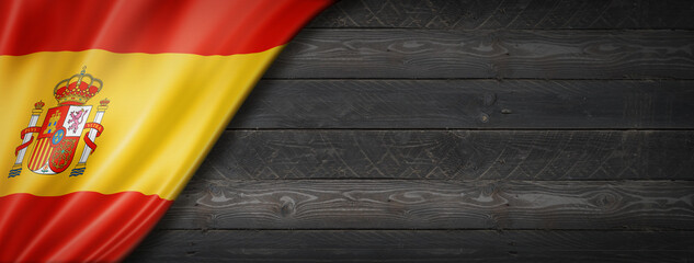 Spanish flag on black wood wall banner
