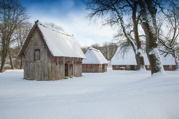  Half-timbered houses in Wilsede, Lueneburg Heath Nature Reserve in freshly fallen snow, (Calluna...