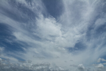 White clouds in the blue sky during the day. Roof replacement tool. Resource for designers.