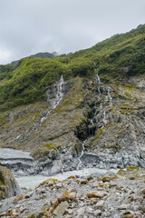 Fototapeta na wymiar waterfalls around Franz Josef Glacier