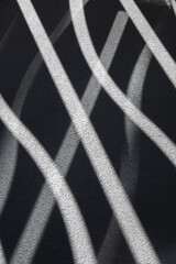 shadows and light on concrete textured surface for abstract background showing futuristic curved...