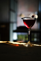 Delicious red cocktail in a wine glass