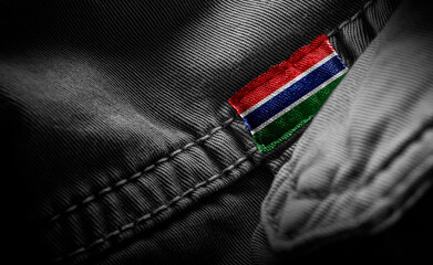 Tag on dark clothing in the form of the flag of the Gambia