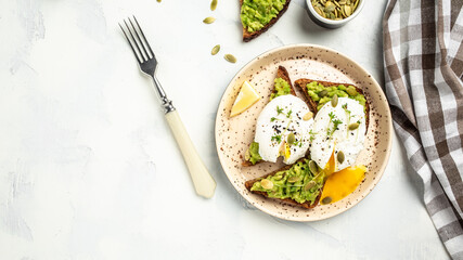 Poached egg toast with avocado on rye bread. banner, menu recipe place for text, top view