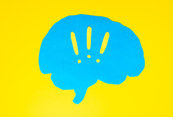 problem concept, blue brain layout with exclamation marks on yellow background