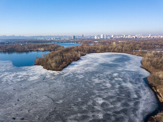 Frozen river in early spring. Aerial drone view.