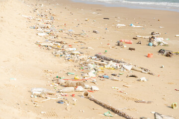 Trash on tropical Beach. Plastic pollution environmental problem.