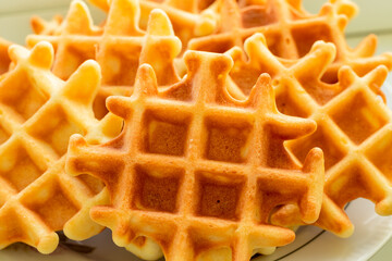 Viennese waffles close-up view from the side of the culinary background.