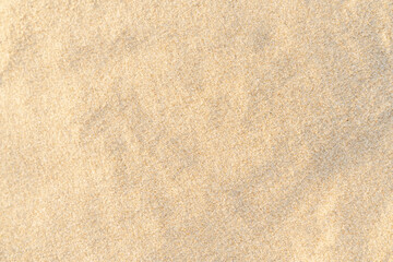 Fototapeta na wymiar Sand texture background. Brown desert pattern from tropical beach.