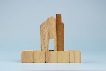 house wood model on blue background.  Real estate concept.