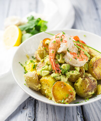 Potato salad with avocado and prawns