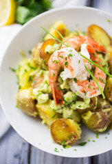 Potato salad with avocado and prawns