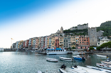 Fototapeta premium Porto Venere, Liguria, Italy. June 2020. Enchanting urban landscape of the colorful houses of the old town overlooking the harbor. Beautiful summer day.